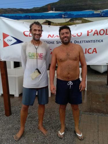 I touched land maybe 90 seconds before the downpour started, having reached the first sailing club I have seen in days... Inexplicably good luck with the timing, again. Pic with fellow drowned rat Rodolfo at Il Club Nautico Paola