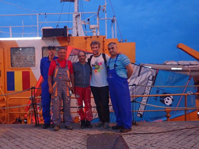 Iulian (second from left) and crew. And stowaway