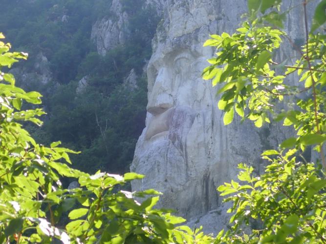 chap in rock face, Romania (Chipu lui Decebal)